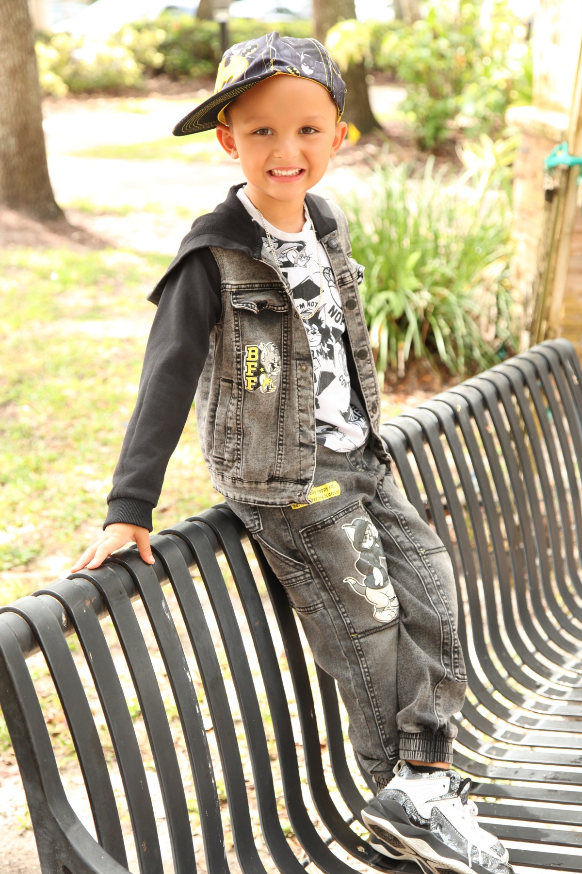 Street look — denim jacket and Batman cap outdoors